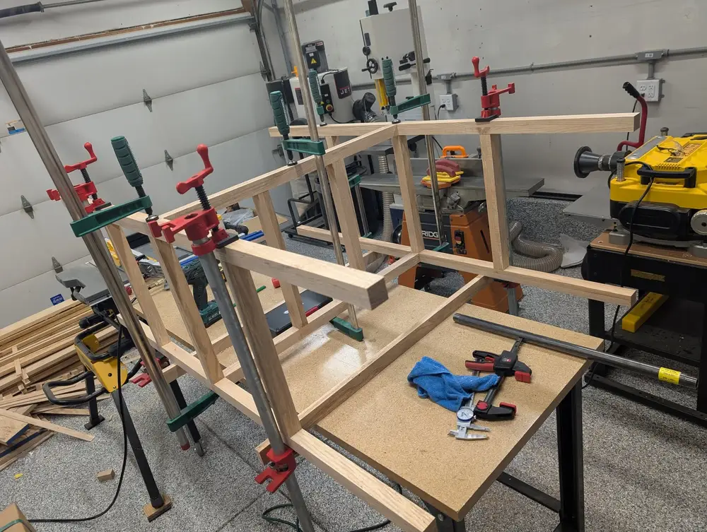 Dresser frames clamped square during glue-up in the shop